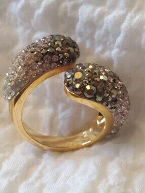 Swarovski Louise ring featuring a gold-toned open wrap design with pave crystals